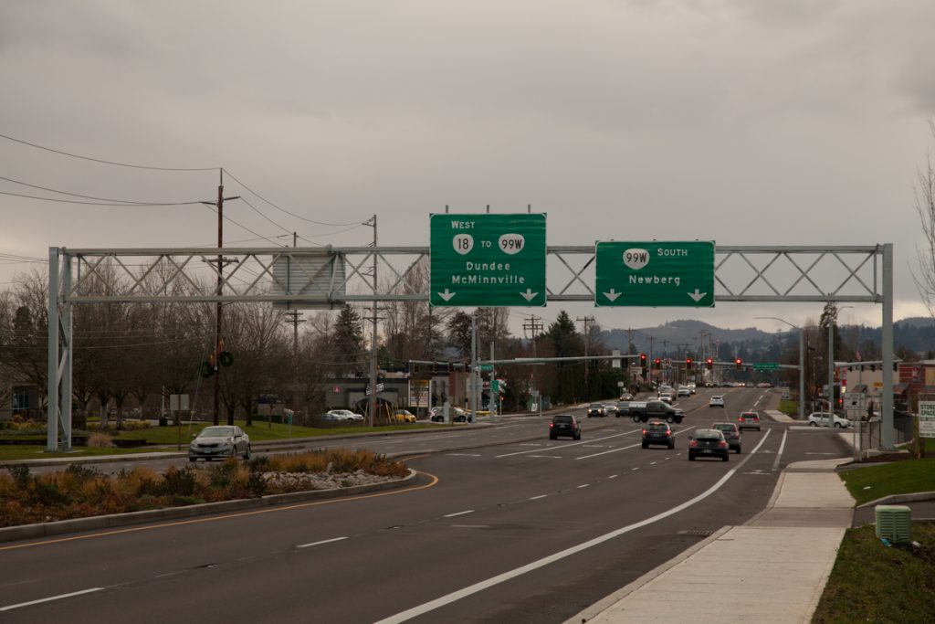 A new sign gantry over 99W just north of the Springbrook Rd. intersection, put up sometime in 2017. The sign implies that OR-18 follows Springbrook and a slight portion of OR-219 before turning onto the bypass. Also, 99W still goes through Dundee, but ODOT omits it from the 99W southbound sign to encourage use of the bypass.