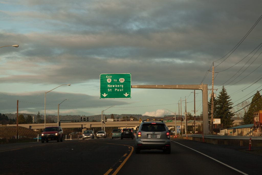 An overhead sign for OR-18 East to OR-219. I'm a bit surprised Portland isn't listed as a control city in this direction, since a fair amount of travelers head between the Portland area and Grand Ronde/the Oregon coast. I bet ODOT believes people will put 2 and 2 together that the road to Newberg = the road to Portland. Also, we get a cardinal direction for OR-18 in this direction, but not going the other direction. This is pretty standard for Oregon when one direction is considered more important than the other.