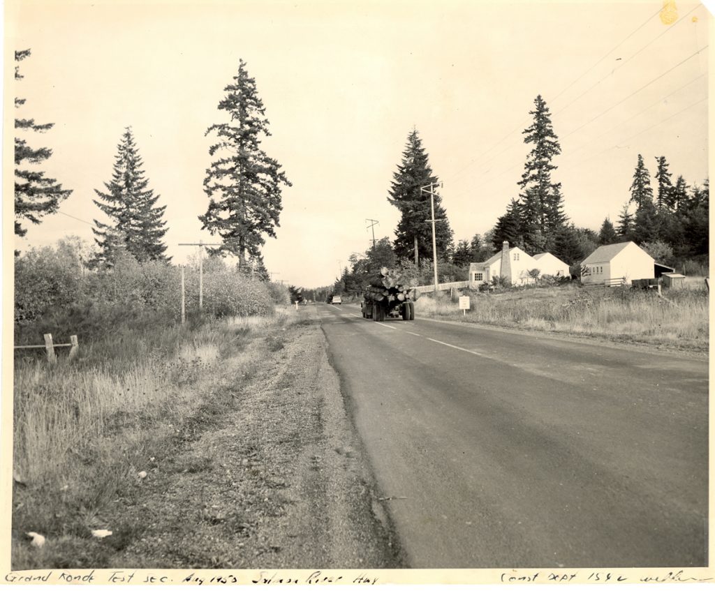 A logging truck travels along the Salmon River Highway near Grand Ronde, August 1950 (OSHD #1540)
